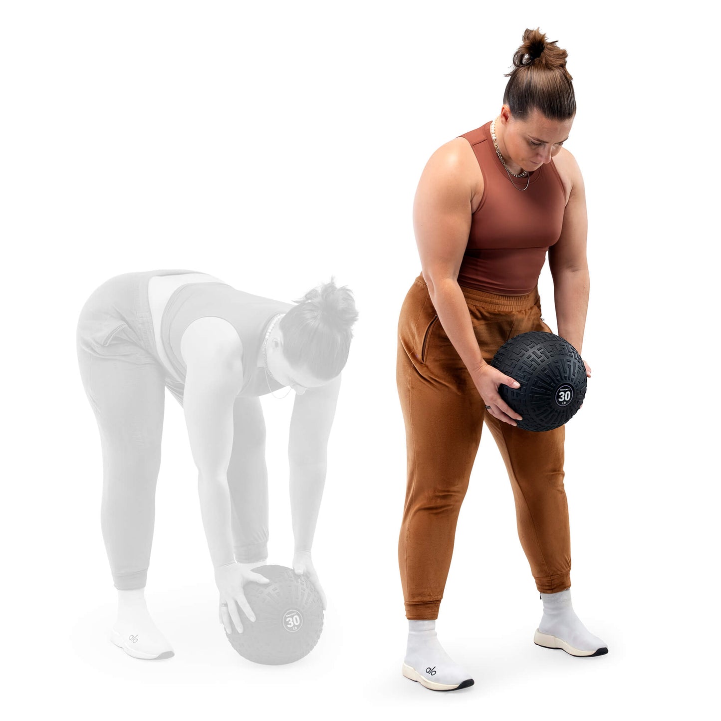 Woman performing a deadlift exercise with a Marcy 30-pound slam ball, shown lifting the weighted ball from the ground to a standing position.