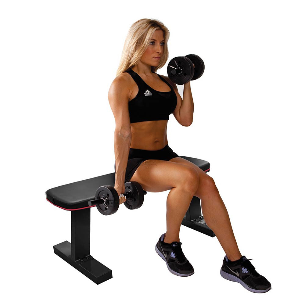 The Marcy SB-10510 Flat Bench utilized by model to do arm curls