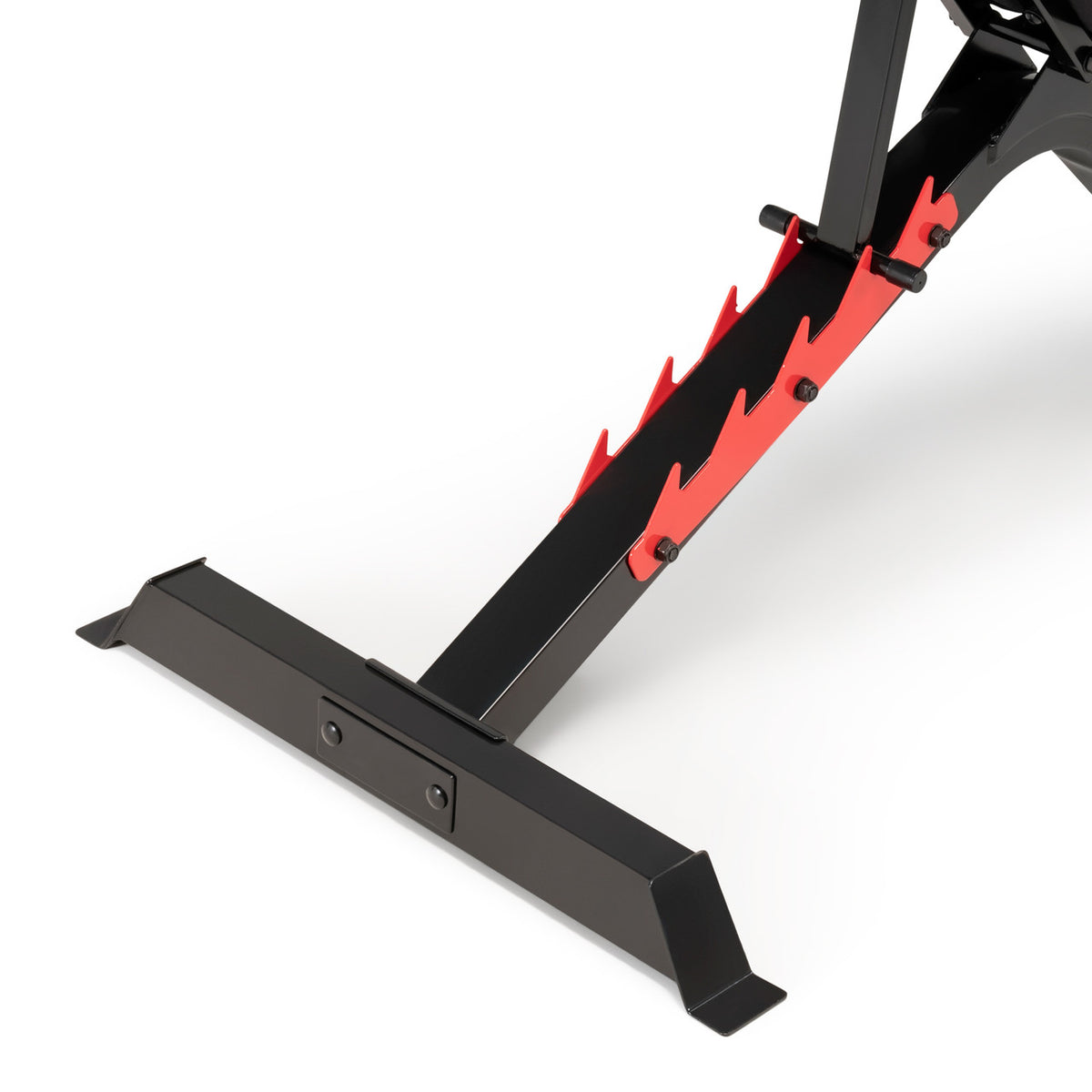 Close-up view of the bench's rear adjustment mechanism, showing a red saw-tooth bracket with multiple slots for changing the backrest angle, attached to the black steel base stabilizer.