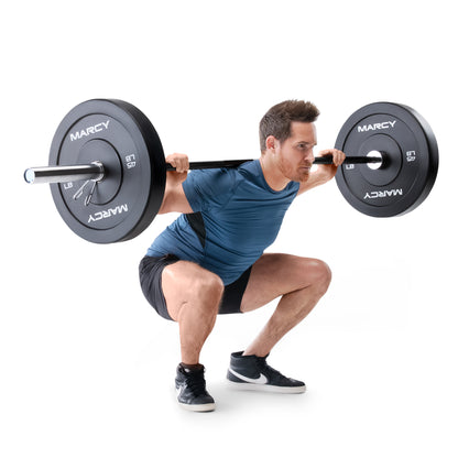 Man performing a squat with a barbell labeled 'Marcy' on a white background