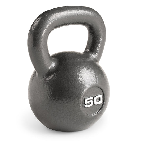 Studio shot of a heavy-duty cast iron Marcy 50lb Hammertone Kettlebell with a textured grey finish. The weight "50" is embossed in white on the front of the spherical body, which features a wide loop handle at the top.