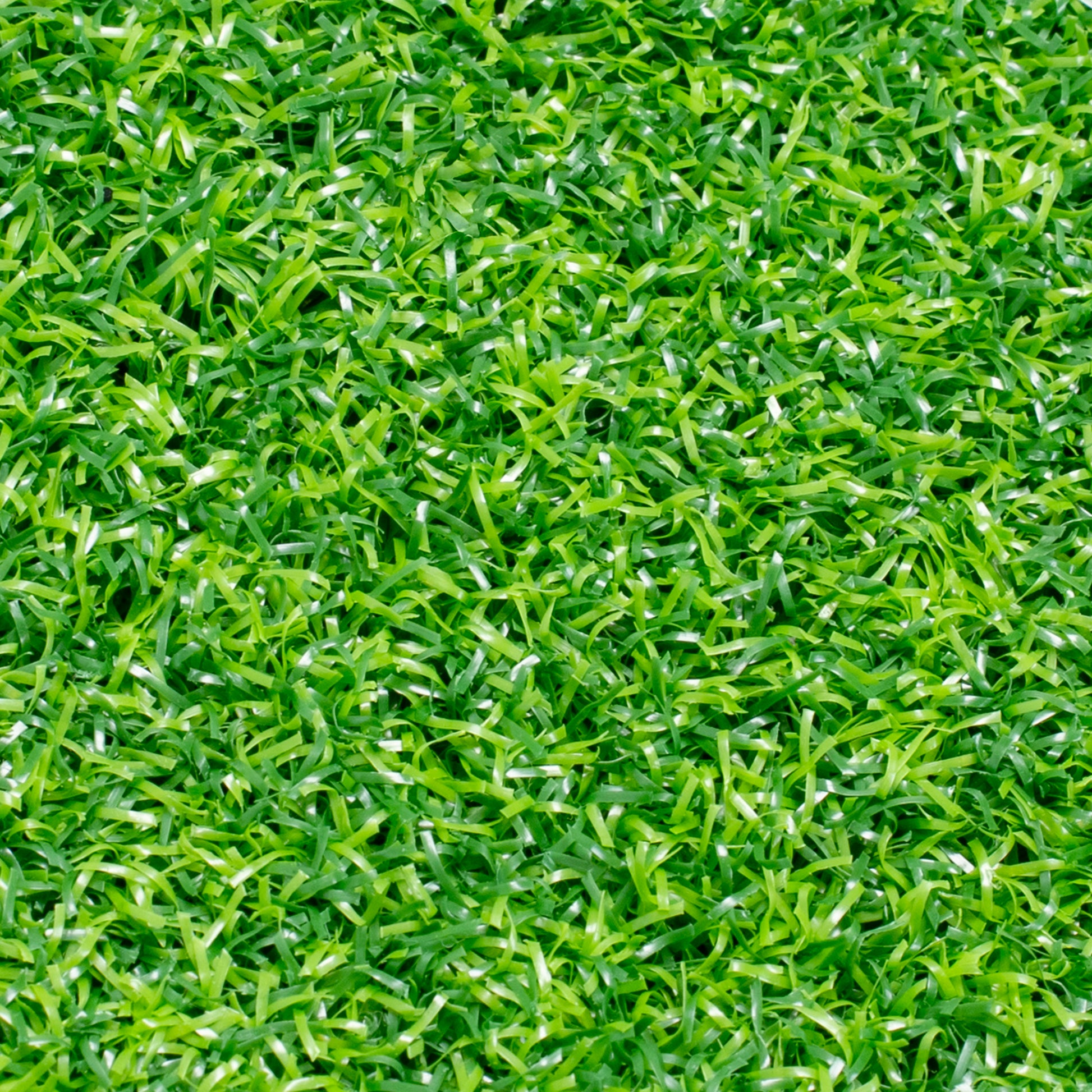 Full-frame top-down view of the green artificial turf texture, showing the density and multi-directional weave of the grass blades.