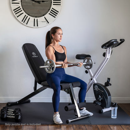 Woman exercising with a barbell on a weight bench in a home gym setting.