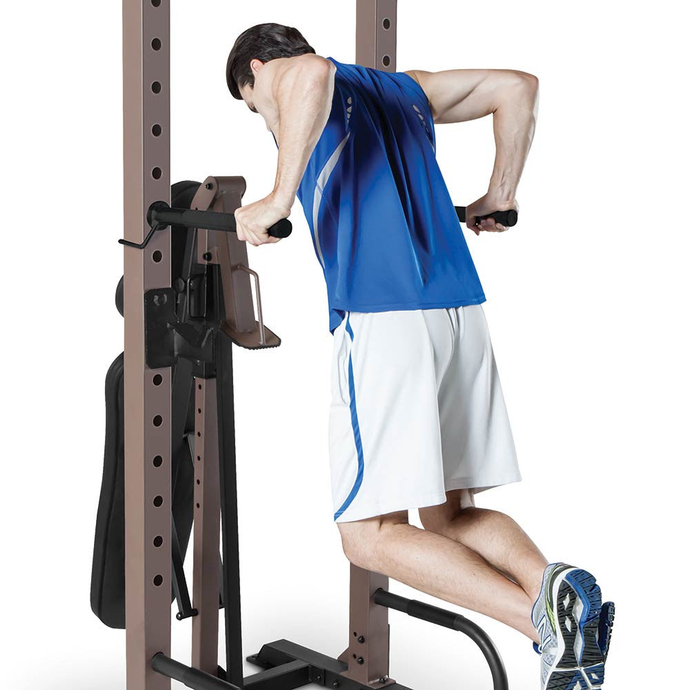 The Steelbody STB-98502 Power Tower with Foldable Bench in use - tricep dips