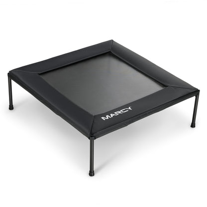 Marcy 40" Square Black Trampoline with a mesh jumping surface and four legs. The perimeter frame is covered by a black safety pad with the Marcy logo printed in white on the front edge.