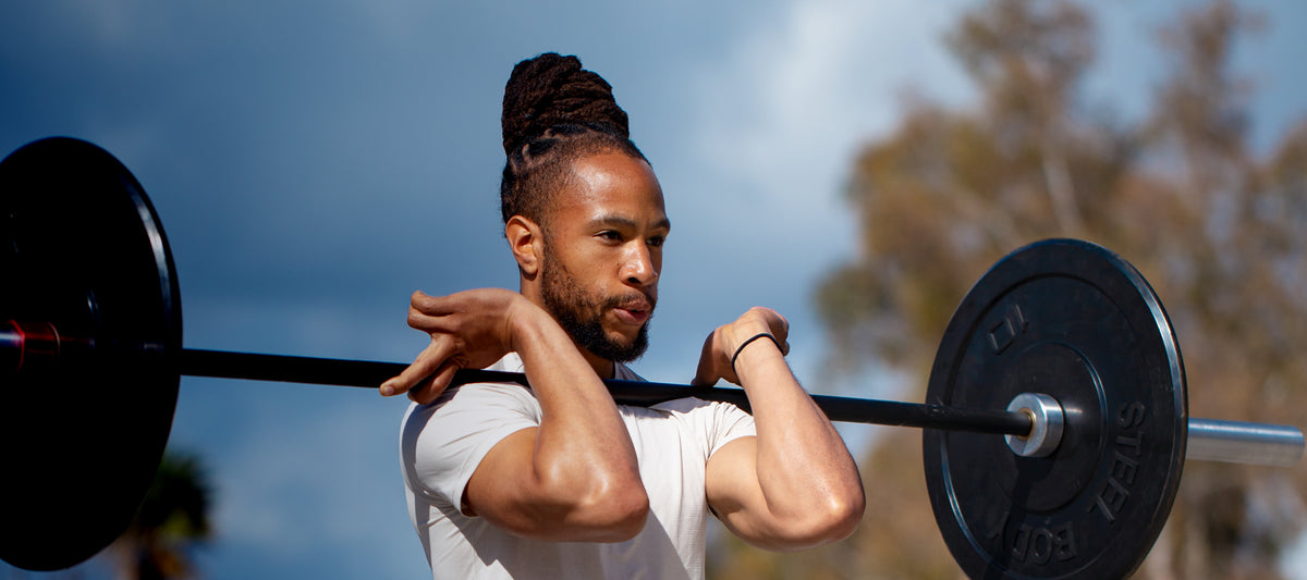 Athlete lifting weights with Marcy fitness equipment